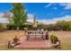 Backyard patio area with outdoor dining furniture and lush landscaping at 6225 W Marconi Ave, Glendale, AZ 85306