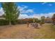 Spacious backyard with seating area and mature trees at 6225 W Marconi Ave, Glendale, AZ 85306