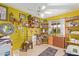 The additional bedroom features decor, storage shelves, a ceiling fan, and natural light from the exterior at 6225 W Marconi Ave, Glendale, AZ 85306