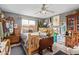 A primary bedroom showcases natural wood furniture and vintage decorations against a grey color palette at 6225 W Marconi Ave, Glendale, AZ 85306