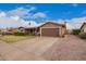 Charming single-story home featuring a spacious driveway and well-maintained landscaping at 6225 W Marconi Ave, Glendale, AZ 85306