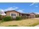 Lovely home with neatly trimmed bushes and green lawn at 6225 W Marconi Ave, Glendale, AZ 85306