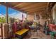 The covered patio boasts southwest decor, an American flag, and views of the outdoors at 6225 W Marconi Ave, Glendale, AZ 85306