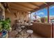 The covered patio features southwest decor, an American flag, and views of the sky at 6225 W Marconi Ave, Glendale, AZ 85306