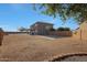 Expansive backyard featuring desert landscaping, a basketball hoop, and a charming covered patio at 6993 S Sharon Ct, Chandler, AZ 85249