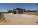 Expansive backyard featuring a pool, desert landscaping, and a full basketball court for recreation and entertainment at 6993 S Sharon Ct, Chandler, AZ 85249