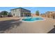 Spacious backyard featuring desert landscaping and a pristine in-ground pool at 6993 S Sharon Ct, Chandler, AZ 85249