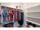 Walk-in closet featuring hanging clothes racks and shelving at 6993 S Sharon Ct, Chandler, AZ 85249