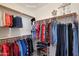 Organized walk-in closet with clothing racks and shoe storage at 6993 S Sharon Ct, Chandler, AZ 85249