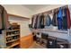 Spacious walk-in closet featuring ample storage, shelving, and closet rod at 6993 S Sharon Ct, Chandler, AZ 85249