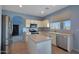 Bright kitchen with stainless steel appliances, an island, and views of the backyard at 6993 S Sharon Ct, Chandler, AZ 85249