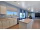 Bright kitchen featuring an island, modern appliances, and ample counter space at 6993 S Sharon Ct, Chandler, AZ 85249