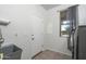 Functional laundry room features a sink, a window, and a door at 6993 S Sharon Ct, Chandler, AZ 85249