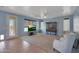 Living room with tile flooring, a TV, and a view of the pool at 6993 S Sharon Ct, Chandler, AZ 85249