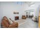 Open-concept living room boasts lots of natural light, neutral tones, and seamless flow to dining space at 6993 S Sharon Ct, Chandler, AZ 85249