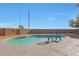 Sparkling pool featuring a sun decoration on brick fence and chairs on a concrete pool deck at 6993 S Sharon Ct, Chandler, AZ 85249