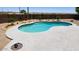 Refreshing kidney-shaped pool in a well-maintained backyard, perfect for relaxation and outdoor enjoyment at 6993 S Sharon Ct, Chandler, AZ 85249