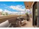 Relaxing outdoor balcony with seating, decorative lanterns, and scenic treetop views at 702 S Beck Ave, Tempe, AZ 85281