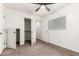 Neutral bedroom featuring carpet, ceiling fan, window with blinds, and access to the closet and bathroom at 702 S Beck Ave, Tempe, AZ 85281