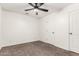 Neutral-toned bedroom featuring carpet, a ceiling fan, window, and closet at 702 S Beck Ave, Tempe, AZ 85281