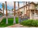 Townhome complex featuring a swimming pool and lush landscaping, offering a resort-style living experience at 702 S Beck Ave, Tempe, AZ 85281