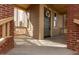 Charming front entrance with brick pillars, a decorated door, and warm lighting at 702 S Beck Ave, Tempe, AZ 85281