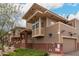 Side exterior view of the townhome featuring brick accents and well-placed windows, showcasing quality construction at 702 S Beck Ave, Tempe, AZ 85281