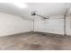 Clean and spacious two-car garage featuring sealed concrete floors and an insulated garage door at 702 S Beck Ave, Tempe, AZ 85281