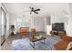 Cozy living room with modern furnishings, a ceiling fan, and plenty of natural light at 702 S Beck Ave, Tempe, AZ 85281