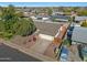 Aerial view of well-maintained home, featuring desert landscaping, a two-car garage, and paved driveway at 7132 W Vermont Ave, Glendale, AZ 85303