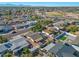 The aerial view showcases a neighborhood with mature trees and mountain views at 7132 W Vermont Ave, Glendale, AZ 85303