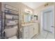 Well-lit bathroom featuring a single sink vanity and decorative accents at 7132 W Vermont Ave, Glendale, AZ 85303