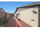 The side yard includes desert landscaping and a brick walkway at 7132 W Vermont Ave, Glendale, AZ 85303