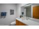 Clean bathroom with modern sink, quartz countertop, art on the wall and silver faucet at 7315 E Northland Dr # 8, Scottsdale, AZ 85251