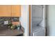 Convenient laundry area with stacked washer and dryer, plus stylish countertop details and storage at 7315 E Northland Dr # 8, Scottsdale, AZ 85251