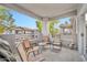 Cozy balcony with chairs, a table, and a view of the complex, perfect for outdoor relaxation at 7401 W Arrowhead Clubhouse Dr # 2012, Glendale, AZ 85308