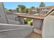 View of the condo complex with its multiple units, landscaping, and parking areas, all under a clear blue sky at 7401 W Arrowhead Clubhouse Dr # 2012, Glendale, AZ 85308