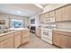 Open kitchen featuring tile floors, wood cabinets, and stainless steel appliances at 7401 W Arrowhead Clubhouse Dr # 2012, Glendale, AZ 85308