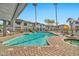 Sparkling community pool and spa surrounded by lounge chairs and palm trees for a resort-like experience at 7401 W Arrowhead Clubhouse Dr # 2012, Glendale, AZ 85308