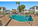 Community pool area with a gazebo, seating, waterfall feature, and well-maintained landscaping at 7401 W Arrowhead Clubhouse Dr # 2012, Glendale, AZ 85308