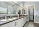 Bathroom boasting dual sinks, sleek countertops, with open access to a walk-in closet at 7518 E Vista Bonita Dr, Scottsdale, AZ 85255