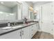 This bathroom has shaker cabinets, double sinks and framed mirrors at 7518 E Vista Bonita Dr, Scottsdale, AZ 85255