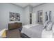 A serene bedroom features an art piece and neutral tones; doorway leads to ensuite at 7518 E Vista Bonita Dr, Scottsdale, AZ 85255