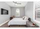 This bedroom features neutral gray paint, a ceiling fan and a TV on the wall at 7518 E Vista Bonita Dr, Scottsdale, AZ 85255