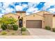 Charming single-story home with a well-manicured front yard, desert landscaping and a spacious two-car garage at 7518 E Vista Bonita Dr, Scottsdale, AZ 85255