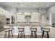 Spacious kitchen island with seating, pendant lighting, and custom cabinetry overlooking the cooking area at 7518 E Vista Bonita Dr, Scottsdale, AZ 85255