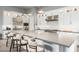 Bright gourmet kitchen featuring an island with seating, stainless steel appliances, and custom lighting at 7518 E Vista Bonita Dr, Scottsdale, AZ 85255