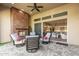 This covered patio has an outdoor fireplace and opens into the kitchen at 7518 E Vista Bonita Dr, Scottsdale, AZ 85255