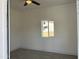 Bright bedroom with neutral walls, modern flooring, and a window, creating a peaceful and inviting atmosphere at 824 S 3Rd Ave, Phoenix, AZ 85003