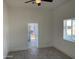 Bright and airy living room with neutral walls, modern flooring, and a view of the front porch through the doorway at 824 S 3Rd Ave, Phoenix, AZ 85003